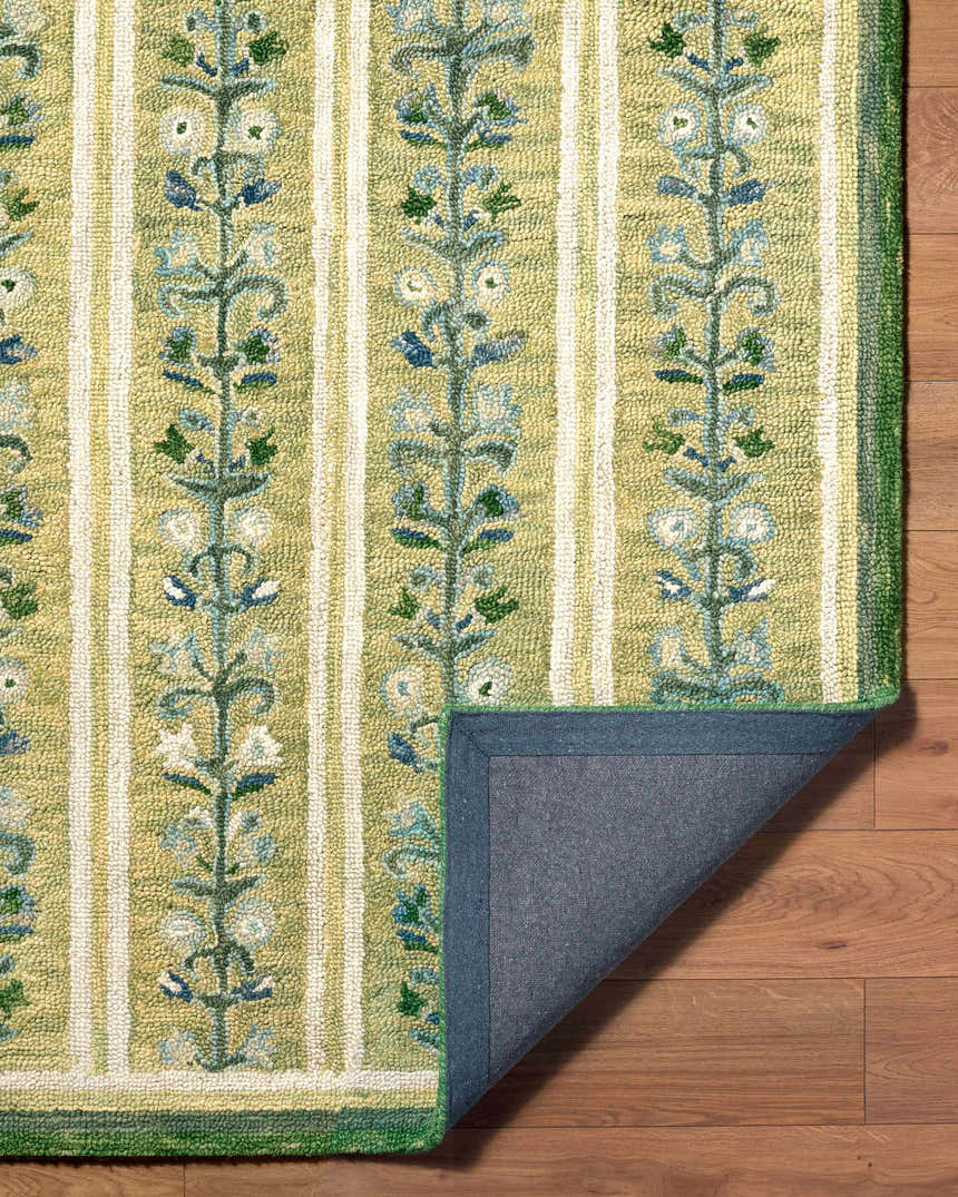 Close-up of the Callen Light Green Area Rug, a hand-tufted wool rug with a floral stripe pattern. Fold