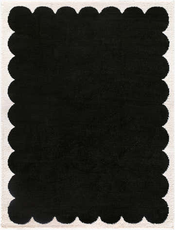 Close-up of the Pidaa Cream Border Rug, a black polyester rug with a cream scalloped border. Design-Rectangle-537