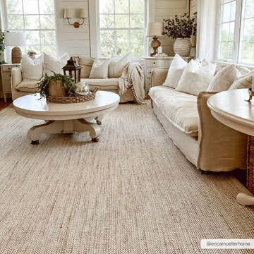 Living room with neutral sofas and round tables on a Gowan Beige Area Rug, creating a cozy, farmhouse-style space. Roomscene-Rectangle