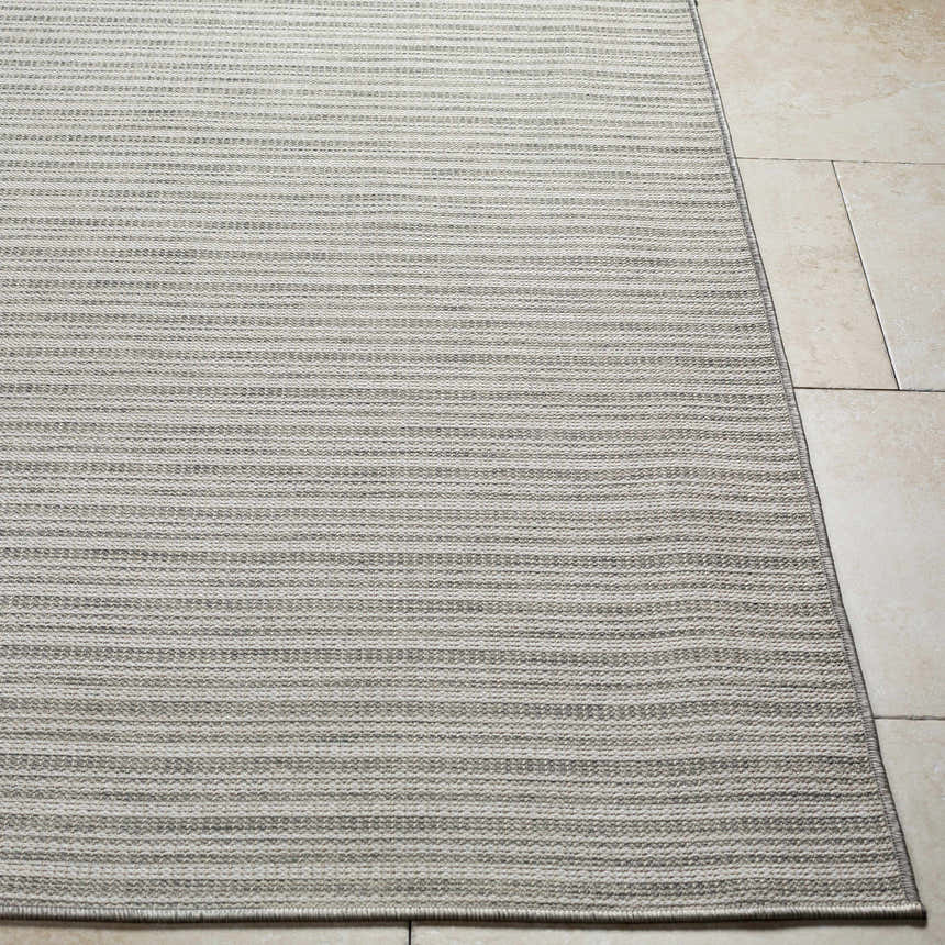 Close-up of the Greg Area Rug in lambswool and multi brown, showing its woven texture and subtle striped pattern. Front