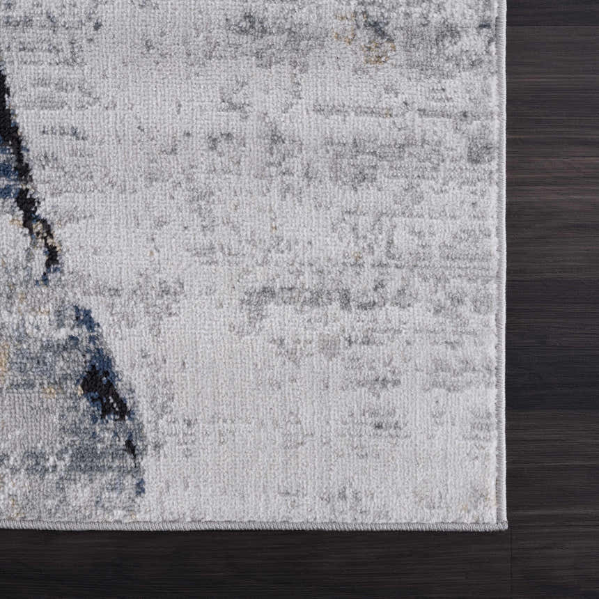 Close-up of the Fremantle Gray Marble Rug showing cream, light gray, dark gray, and gold abstract pattern. Swatch