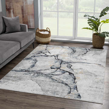 Living room scene with gray sofa and Fremantle Gray Marble Rug featuring cream, gray, and gold tones. Roomscene-Rectangle