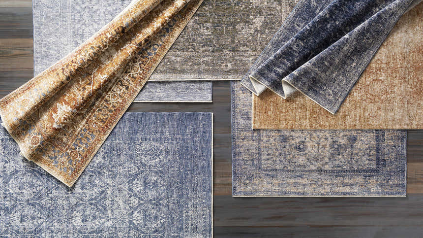 Assorted Onley Area Rugs in denim, gold, beige, and navy. Bohemian, traditional, and vintage styles. Rectangle and runner shapes. Styleshot