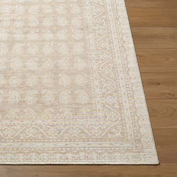 Close-up of Alo Machine Woven Nabela Noor Home rug. Features a traditional pattern in medium gray, mustard, and off-white on wood floor. Front