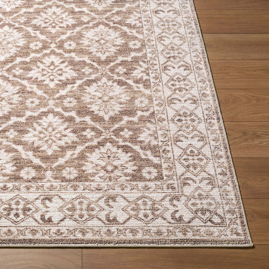 Close up of the Aram Nabela Noor Home x LIVABLISS NBAR-2306 Area Rug showing its brown and gray traditional floral pattern. Front