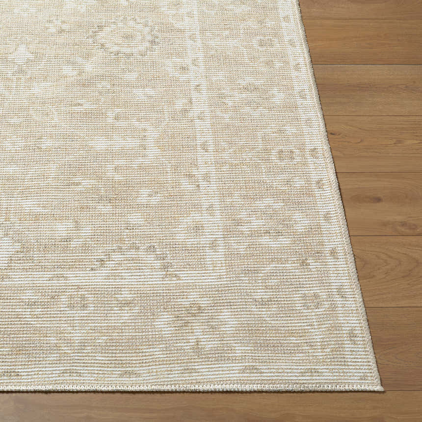 Close-up of Asha Machine Woven Nabela Noor rug showing jute and polyester texture, off-white and gray farmhouse pattern on wood floor. Front