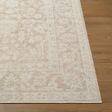 Close-up of Maan Machine Woven Nabela Noor Home x LIVABLISS rug. Jute and polyester rug in medium gray, mustard, and off-white. Front