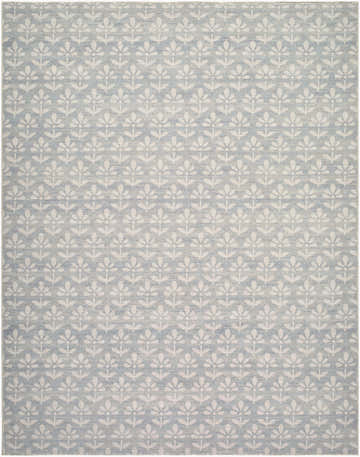 Close-up of the Maya Machine Woven Nabela Noor Home x LIVABLISS NBMY-2301 Area Rug. Sky blue rug with off-white floral pattern. Design-Rectangle-71010