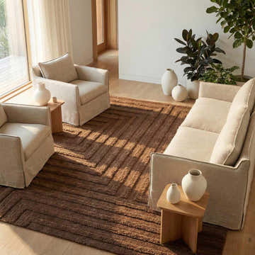 Living room with neutral sofa and chairs on a camel Lokesh Washable Area Rug with a geometric pattern. Roomscene-Rectangle