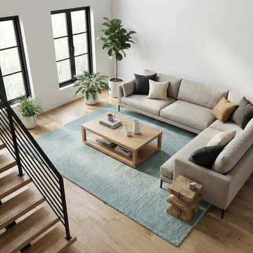 Living room with sage Kanuha Washable Area Rug, light wood floors, neutral sofa, and modern coffee table. Airy and bright. Roomscene-Rectangle