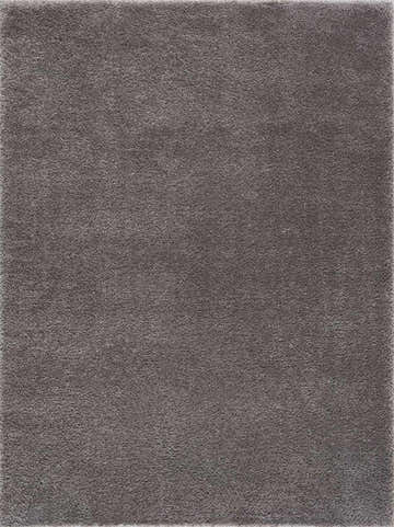 Close-up of the Charven Charcoal rug, showing its subtle wavy texture and minimalist design in gray polyester. Design-Rectangle