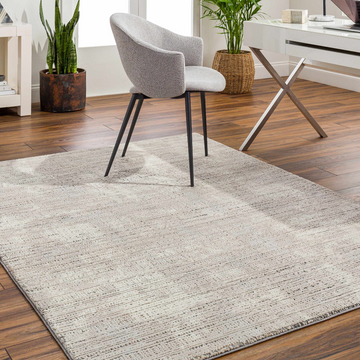 Home office scene with a gray chair on a Chiyo Tan Plush Textured Washable Rug. Roomscene-Rectangle