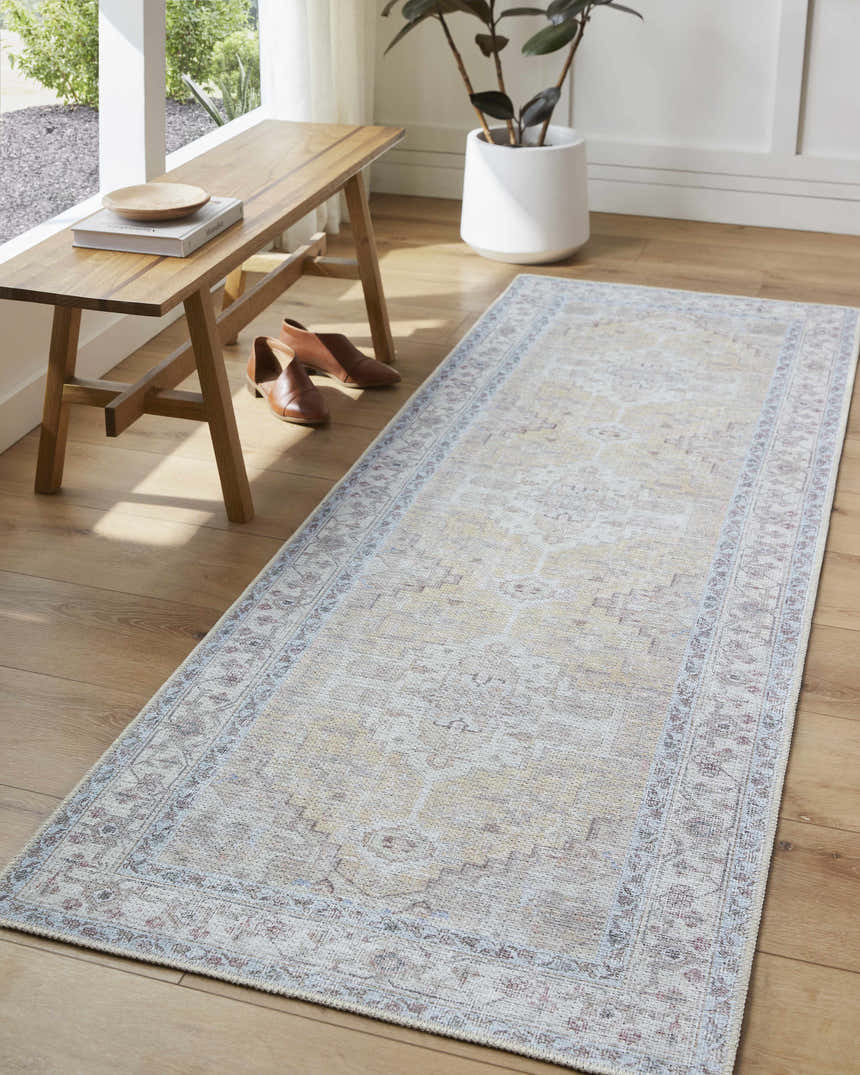 Entryway with Reza Mustard Washable Rug runner, light wood floors, bench, and potted plant near a window. Roomscene-Rectangle