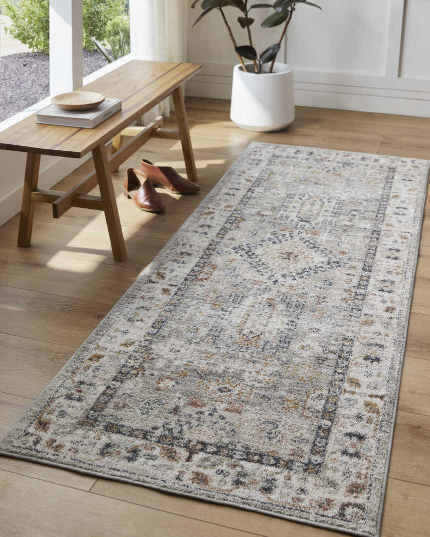 Entryway with wood bench, shoes, and a neutral beige, brown, and blue Kylia Area Rug runner on a wood floor. Roomscene-Runner