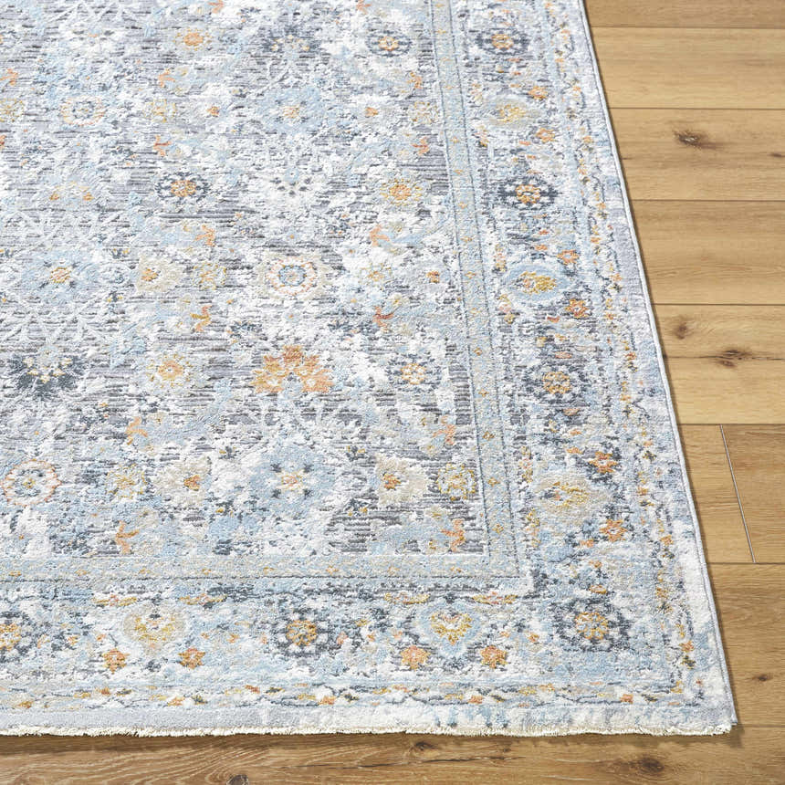 Close-up of the Finn Silver Blue Area Rug showing its traditional floral pattern in silver, gray, blue, and nutmeg tones. Front