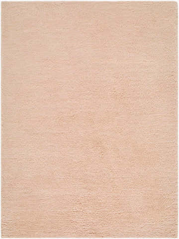 Close-up of the hand woven Kanuha Washable Area Rug. Plush, blush pink wool rug with a subtle texture. Design-Rectangle