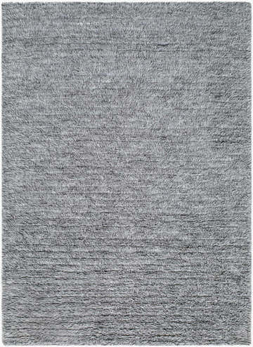 Close-up of the Kanuha Washable Area Rug, hand woven in shades of charcoal, silver gray, and steel gray wool. Contemporary style. Design-Rectangle