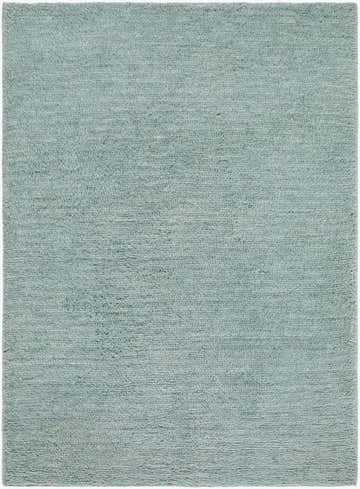 Close-up of the hand woven Kanuha Washable Area Rug. Sage green wool rug with a subtle, contemporary texture. Design-Rectangle