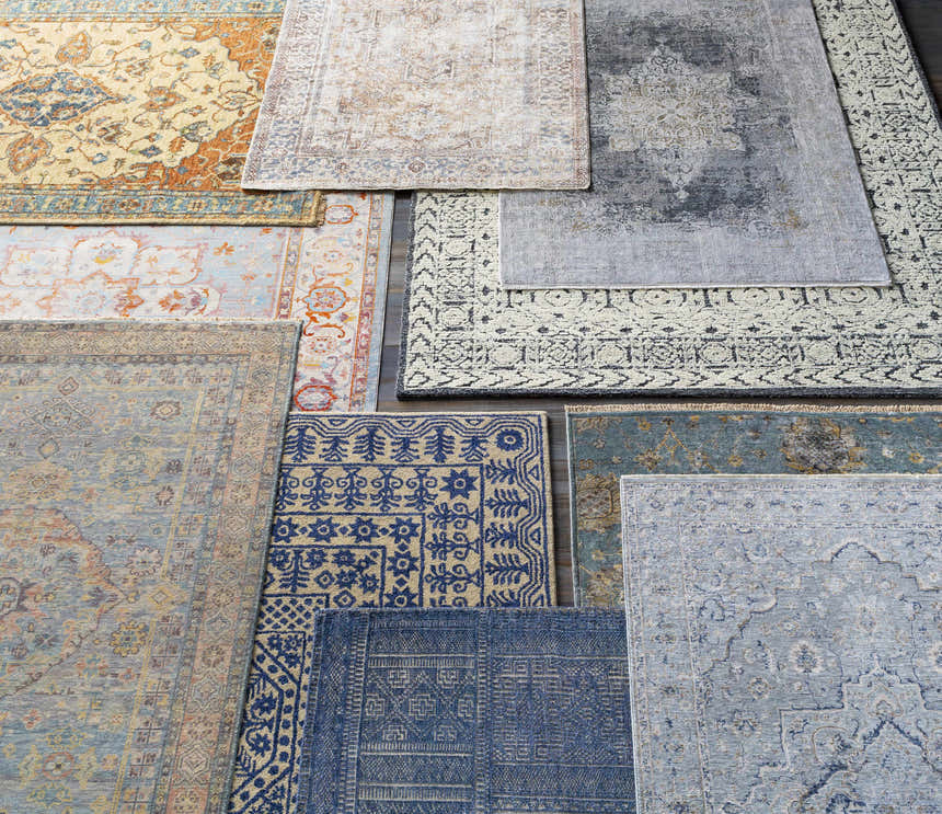 Assorted Brodhead Luxe Area Rugs in blush, brown, cream, navy, and blue hues with bohemian, oriental, and traditional patterns. Styleshot