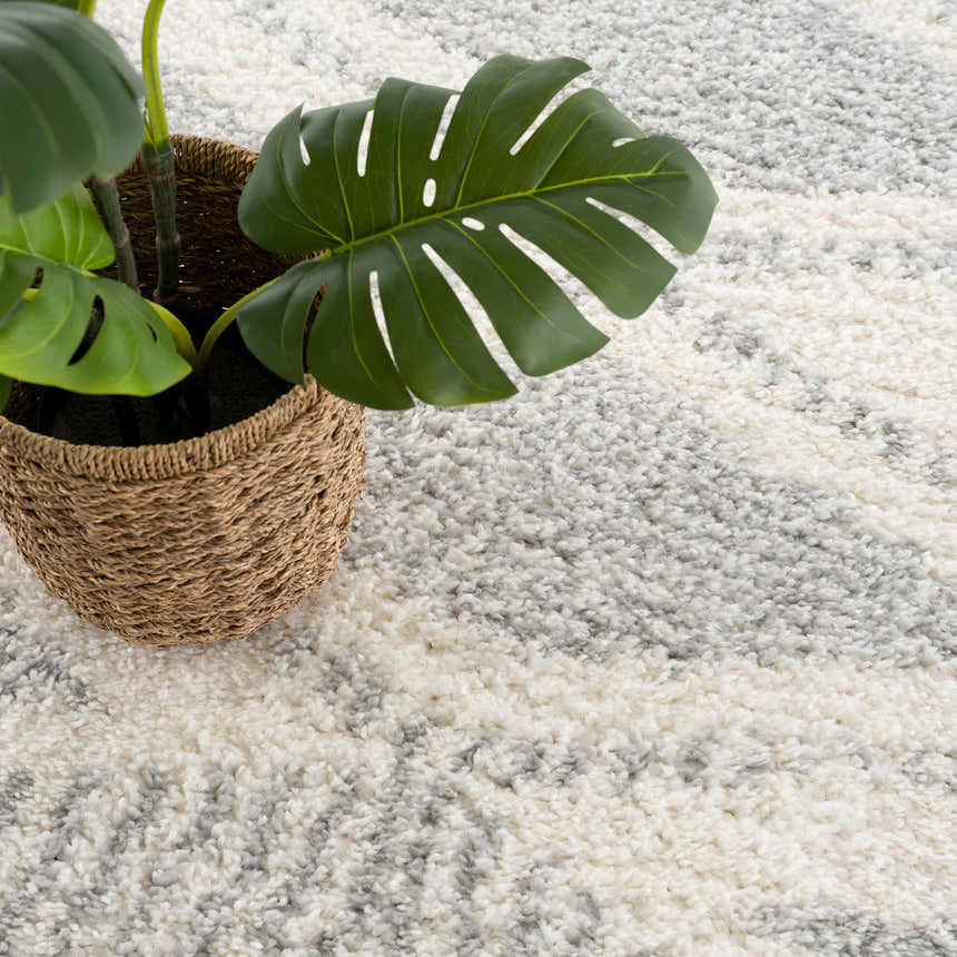Close-up of the Trunding Plush Area Rug in Gray, featuring a geometric shag design and soft, plush texture. Styleshot