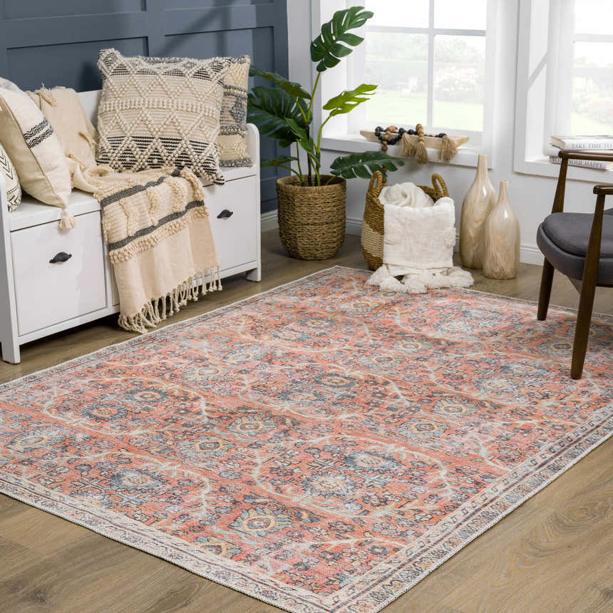 Living room scene with Urpi Rose & Blue Washable Area Rug. Farmhouse style with peach, blue, and cream tones. Roomscene-Rectangle