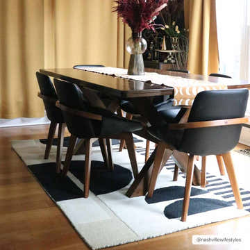 Dining room with a Brooklyn Modern black and cream rug under a dark wood table and black chairs. Roomscene-Rectangle