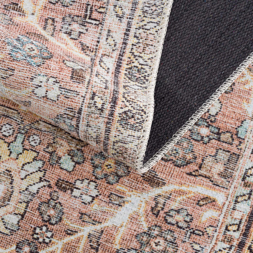 Close-up of the Flat Pile Urpi Red Washable Rug, showing its traditional Persian pattern, red hues, and durable gray backing. Fold