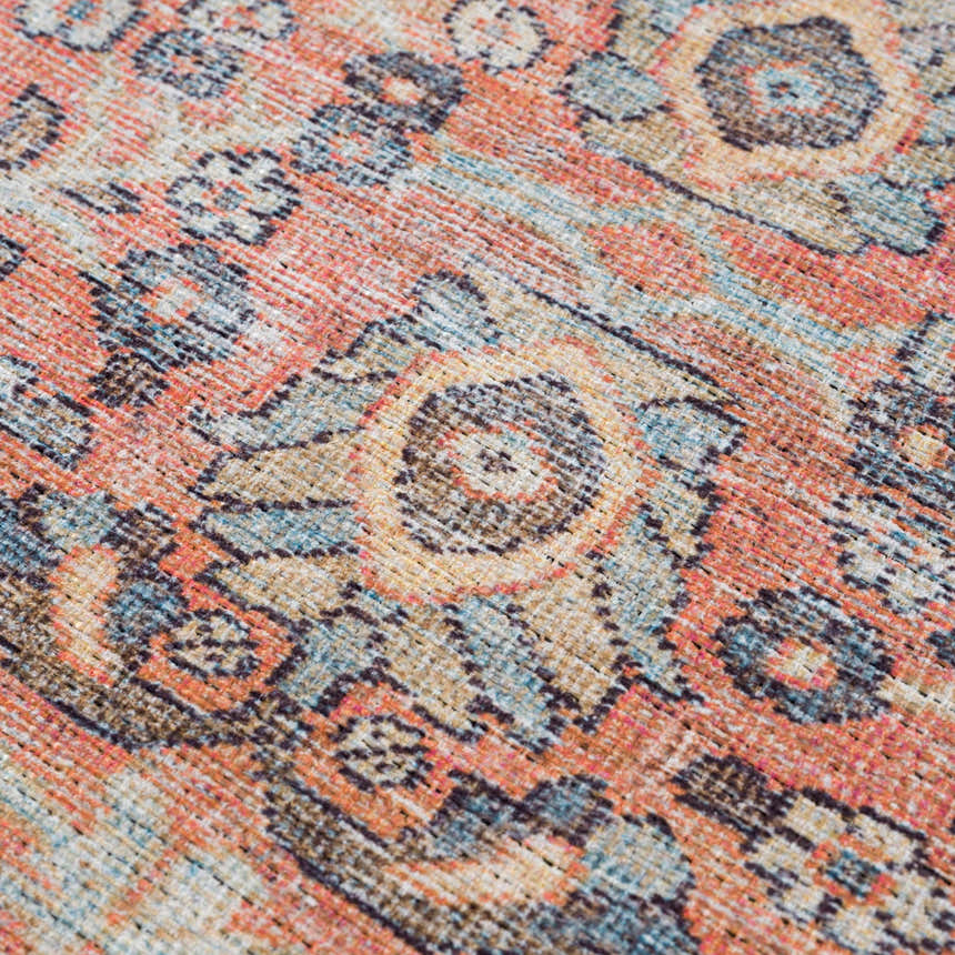 Close-up of the Konstantina Washable Area Rug showing a traditional Persian-style pattern in aqua, beige, and brown tones. Texture