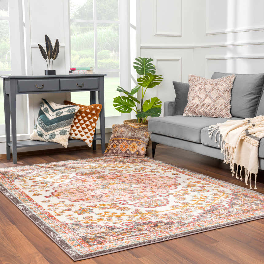 Living room scene with gray sofa and Oark Floral Medallion Area Rug in brick red, camel, and off-white colors. Roomscene-Rectangle