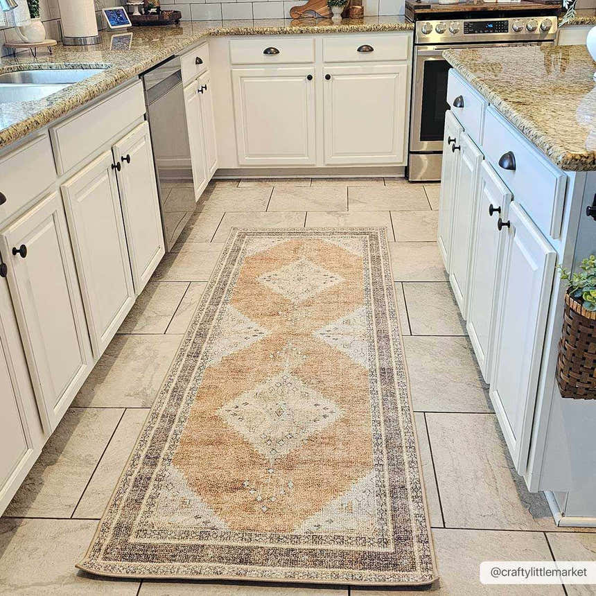 Farmhouse kitchen with white cabinets and a light brown Albas Washable Area Rug runner on the tiled floor. Roomscene-Runner
