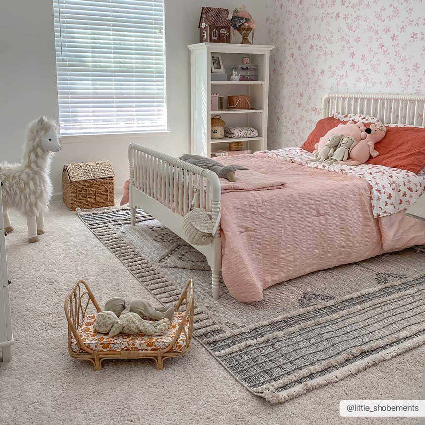 Kids bedroom with a white bed on the Amaga High-Low Rustic Rug in charcoal, cream, and beige tones. Roomscene-Rectangle