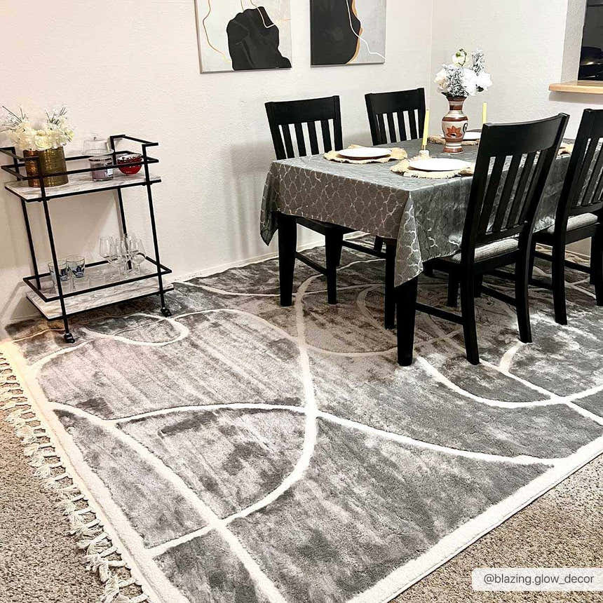 Dining room with Azana Modern Gray Area Rug, black chairs, gray tablecloth, and bar cart. Roomscene-Rectangle
