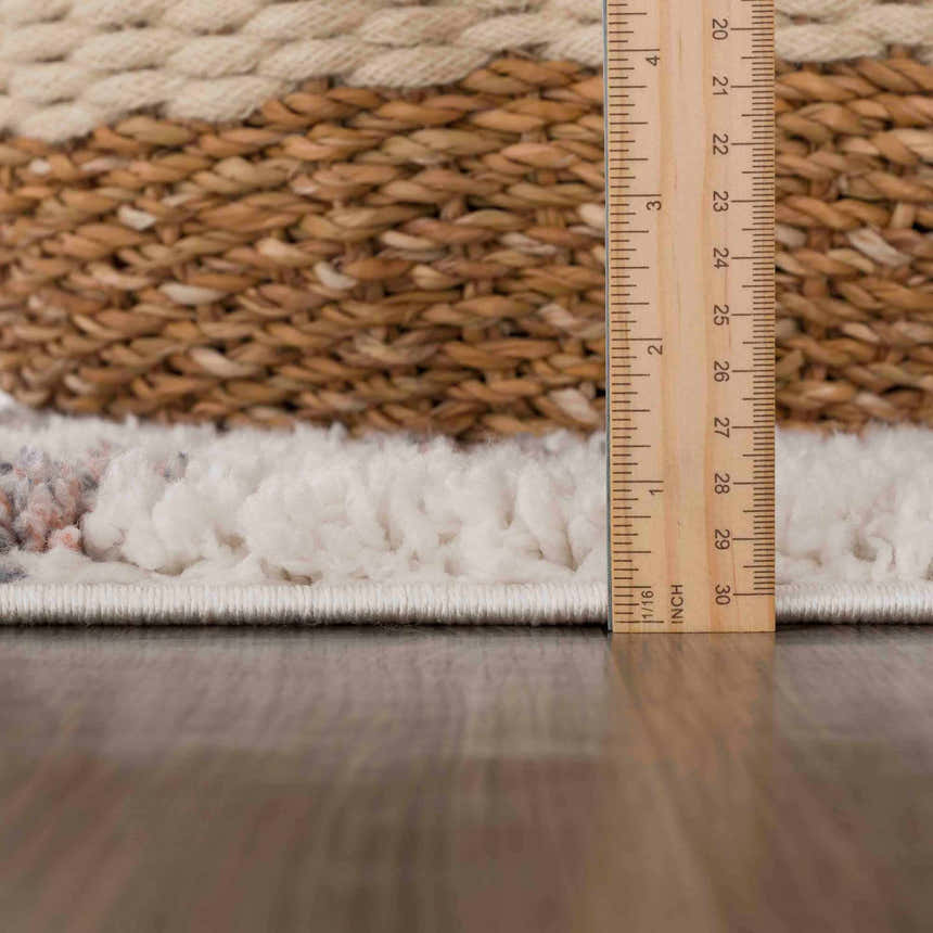 Close-up of the Zhen Pink Spots Leopard Rug showing its plush texture, pink spots, and ruler for scale. Pile