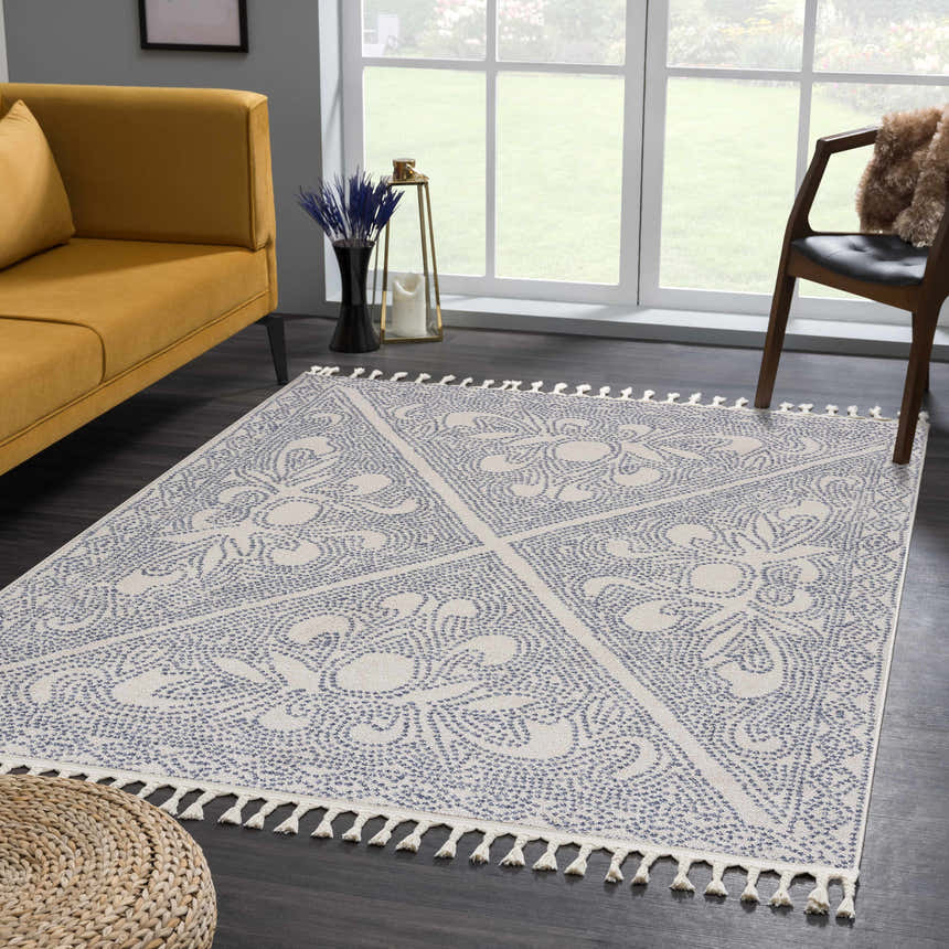 Living room scene with a Birdwood Navy Area Rug, yellow sofa, and natural light. Roomscene-Rectangle