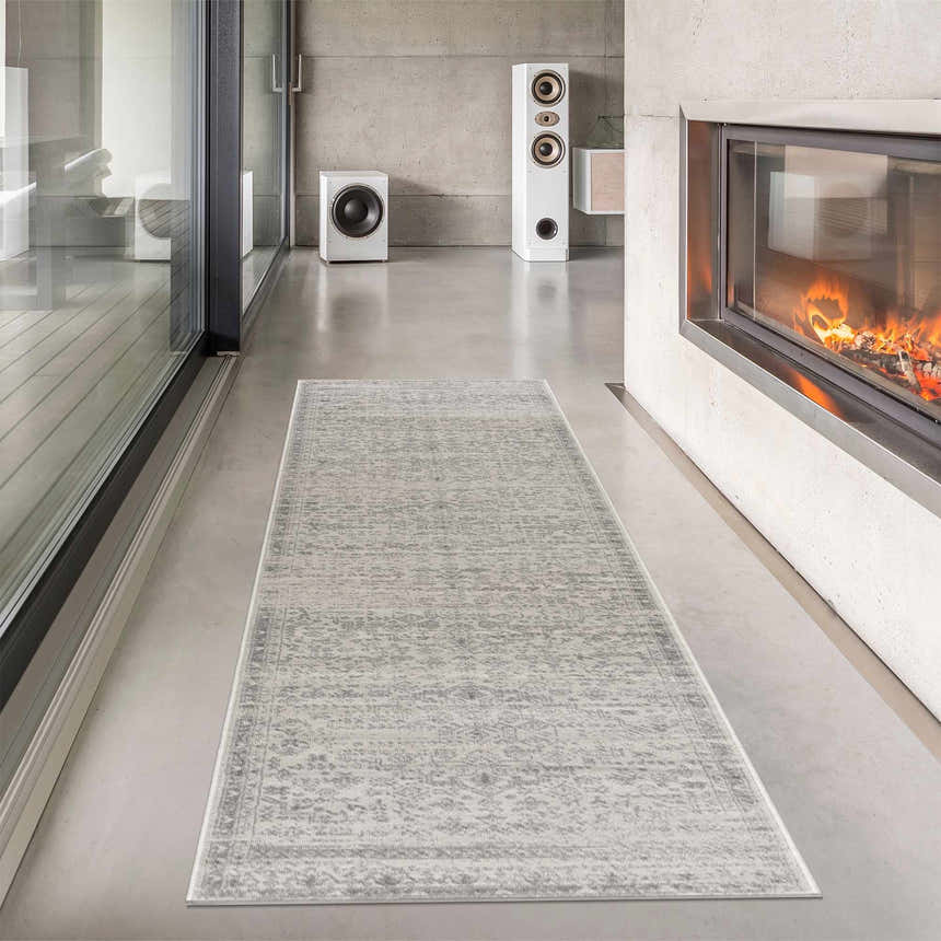 Modern living room scene with a Tigried Ivory & Gray 2323 Area Rug runner in front of a fireplace. Roomscene-Runner