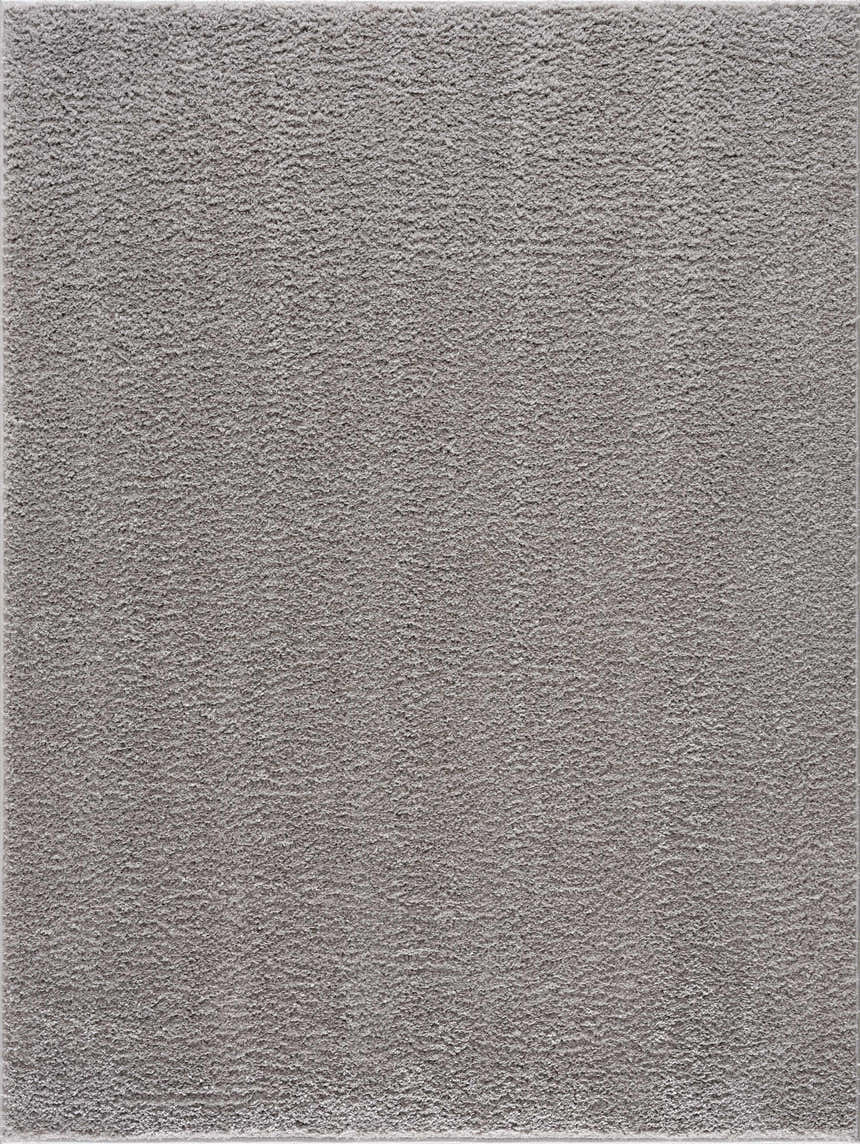 Close-up of the Judy Solid Gray Washable Shag Rug, showing its soft, textured pile and light gray color. Design-Rectangle