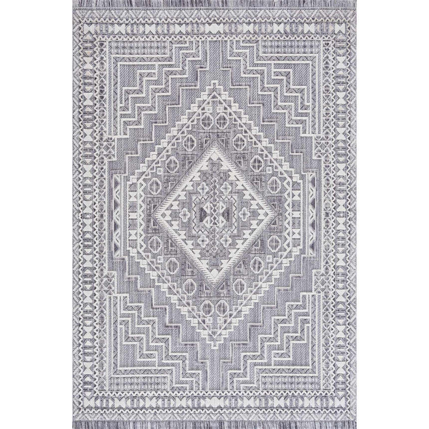 Close-up of the Alya 3D Saxony Area Rug. Gray, light gray, and white geometric pattern with fringe. Design-Rectangle