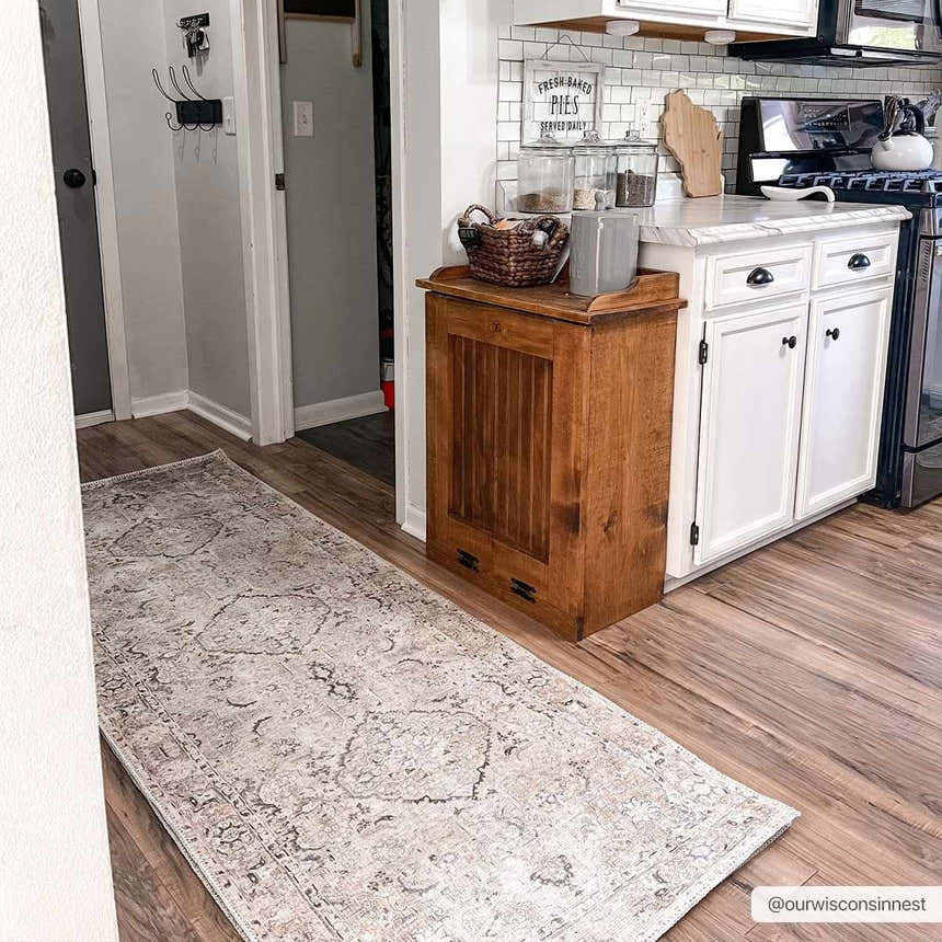 Farmhouse kitchen with a Standon Vintage Flat Pile Washable Rug runner on wood floor. Neutral tones and white cabinets. Roomscene-Runner
