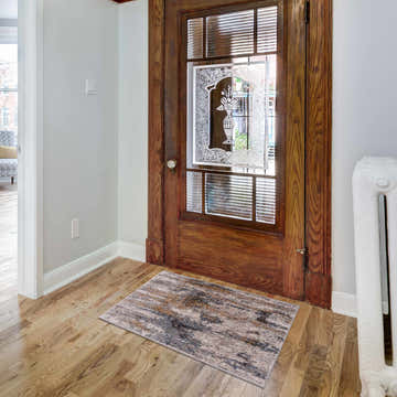 Entryway with wood floors and Lurnea Luxe Fringe Rug in dark blue, light blue, medium gray, and mustard colors. Roomscene-Rectangle