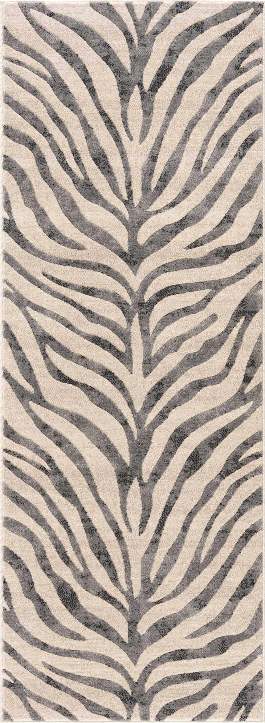 Close-up of the Gray Ecorse Zebra Print Area Rug, featuring a black, charcoal and light beige animal pattern. Design-Runner-2773