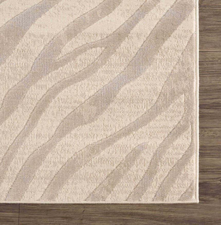 Close-up of the Beige Manteca Zebra Print Area Rug showing its light beige and gray animal pattern and soft texture. Swatch