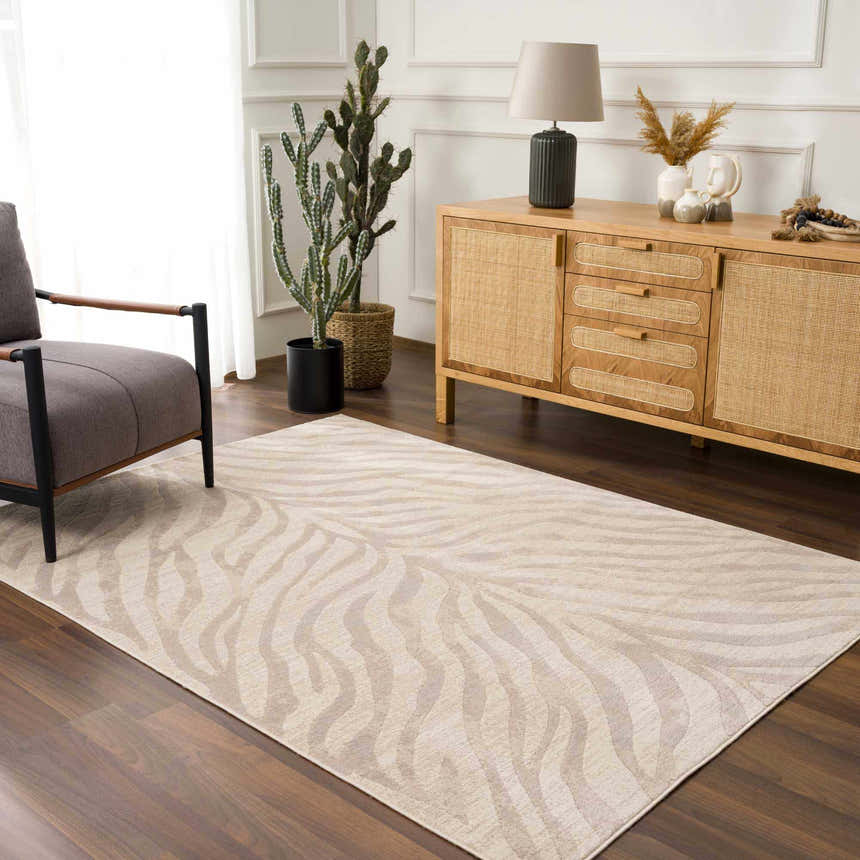 Living room scene with a beige Manteca Zebra Print Area Rug, gray chair, and wooden cabinet. Roomscene-Rectangle