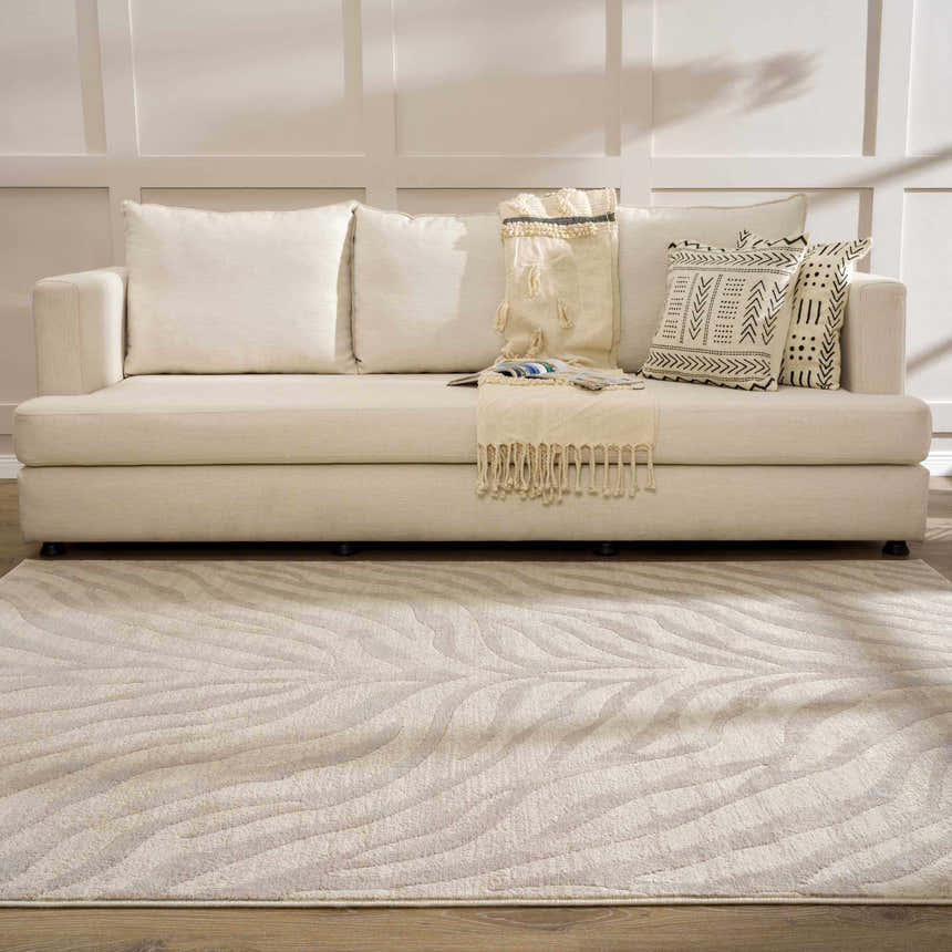 Living room scene with a Beige Manteca Zebra Print Area Rug, light beige sofa, and neutral decor. Roomscene-Rectangle