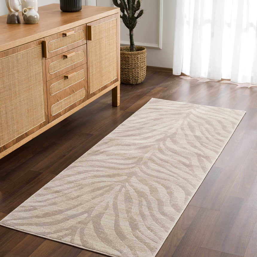 Entryway with a Beige Manteca Zebra Print Area Rug, wood floors, and a light wood cabinet. Roomscene-Runner
