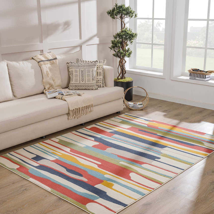 Living room scene with a Southfields Colorful Modern Area Carpet, beige sofa, and natural light. Roomscene-Rectangle