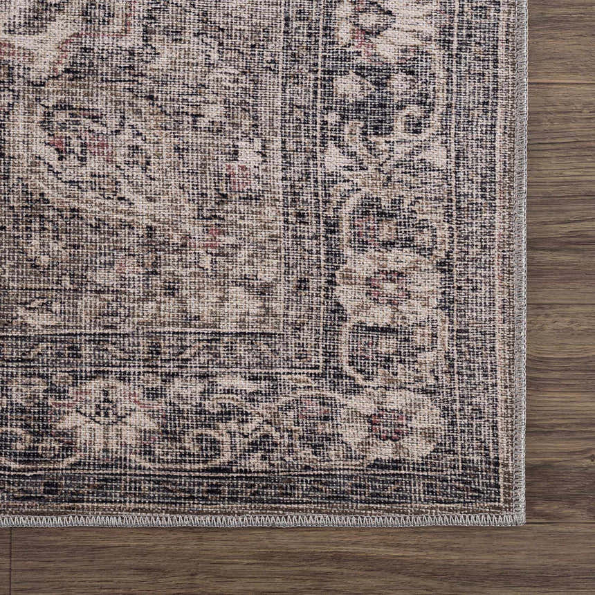 Close-up of the Greenpoint Dusty Blue Washable Rug. Beige, black, and red oriental pattern on a chenille-polyester rug. Swatch