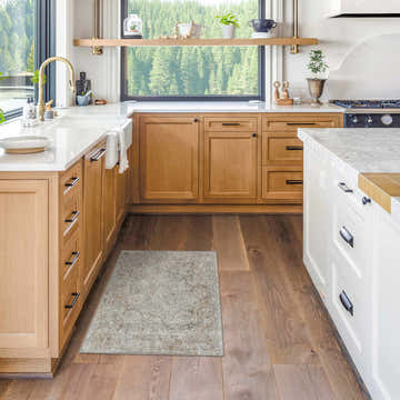 Light-filled kitchen with wood cabinets and the gray and brown Pyote Textured Luxe Area Rug on hardwood floors. Roomscene-Rectangle