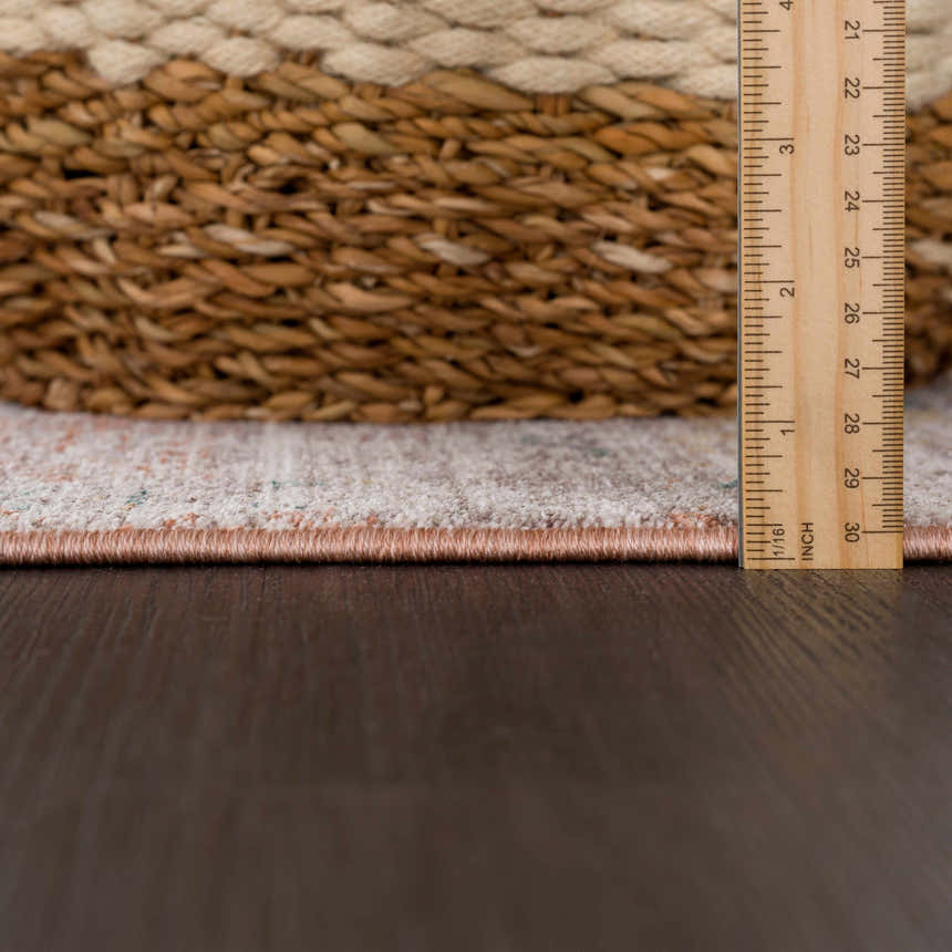 Close-up of the Casta Area Rug showing the pile height, colors, and machine-woven construction. Beachhouse color. Pile