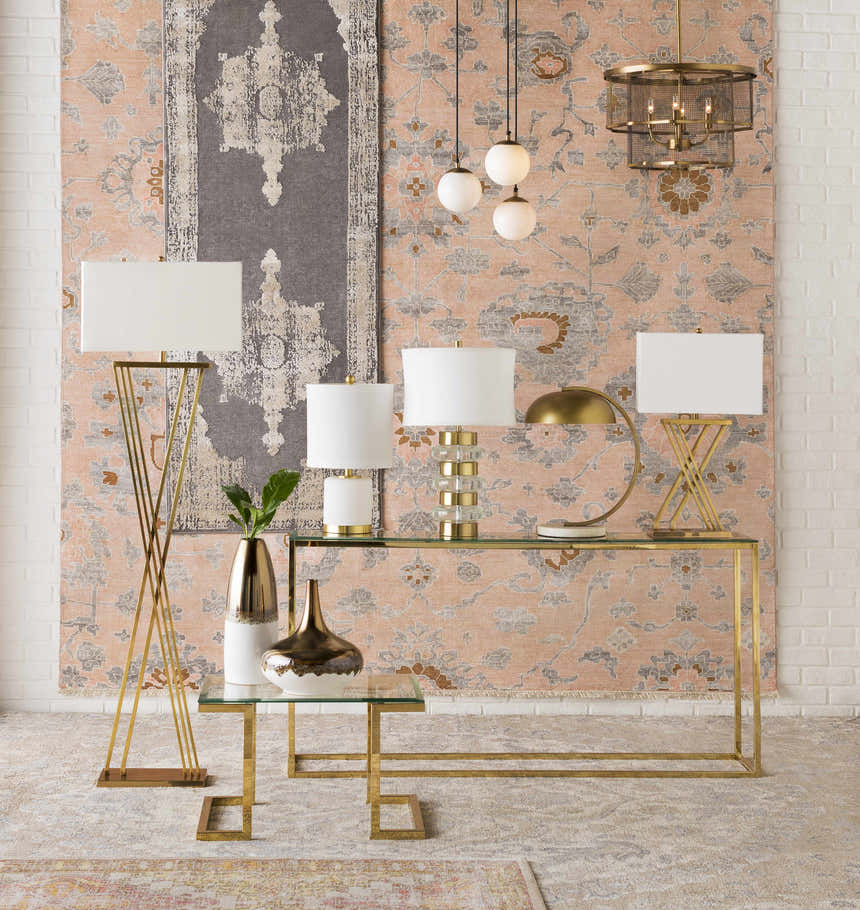 Styled room scene with Pittston Area Rug in beige, coral, and charcoal. Features gold accents and a modern farmhouse aesthetic. Styleshot