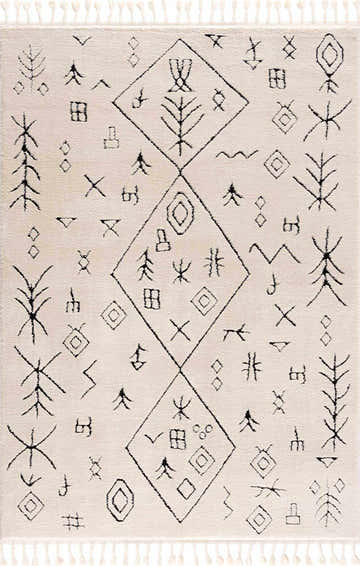 Close-up of the Thian Tribal Area Rug. Beige rug with black tribal-inspired geometric diamond and tree pattern. Tassels on the edges. Design-Rectangle-46